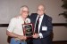 Dr. Nagib Callaos, General Chair, giving Dr. Jeremy Horne a plaque "In Appreciation for Delivering a Great Keynote Address at a Plenary Session."